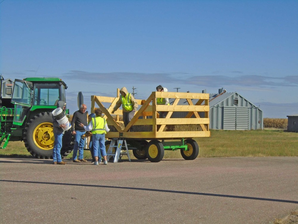Hay wagon hauled the adults and youth to the site north of Atkinson.