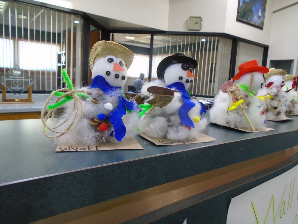 Snowmen made by Mrs. Roemer’s West Holt Kindergarten class are on display at Great Western Bank in Atkinson.