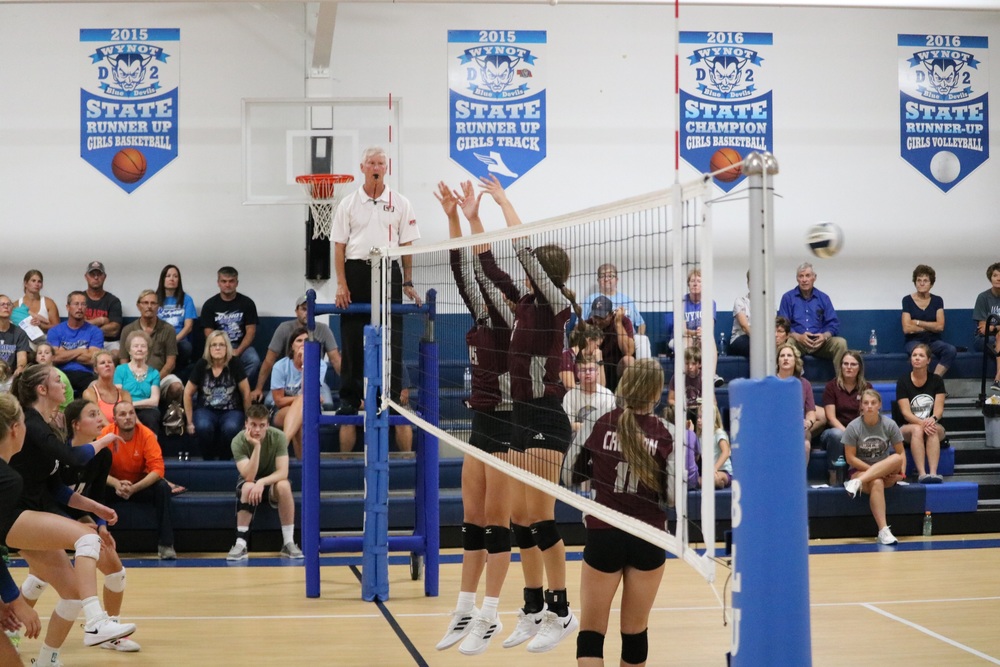 Caitlin Guenther and Jaisie Janssen go up for a block