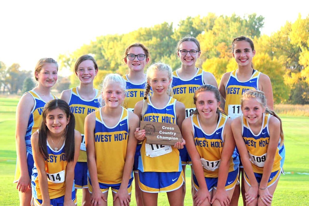 The Junior High Lady Huskies brought home the conference championship plaque from the Niobrara Valley Conference meet held at Neligh last week. Members of the team are front, Anel Monasterio, Pavan Larson, Madison Kratz, Madalyn Pistulka, and Cale Deseive; back, Lily Vogel, Taylor Walnofer, Abby Davis, Makenna Schaaf, and Ava Hoffman.	Photo courtesy Miechelle Davis