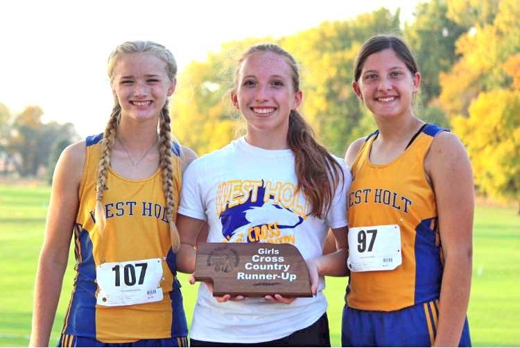 The Lady Huskies high school cross country team brought home the conference runner up plaque from the Niobrara Valley Conference meet held at Neligh last week. Members of the team who competed were Abby Thiele, Brianna Rentschler, and Maddie Davis.	Photo courtesy Miechelle Davis