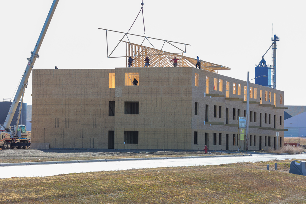 One of two apartment buildings under construction