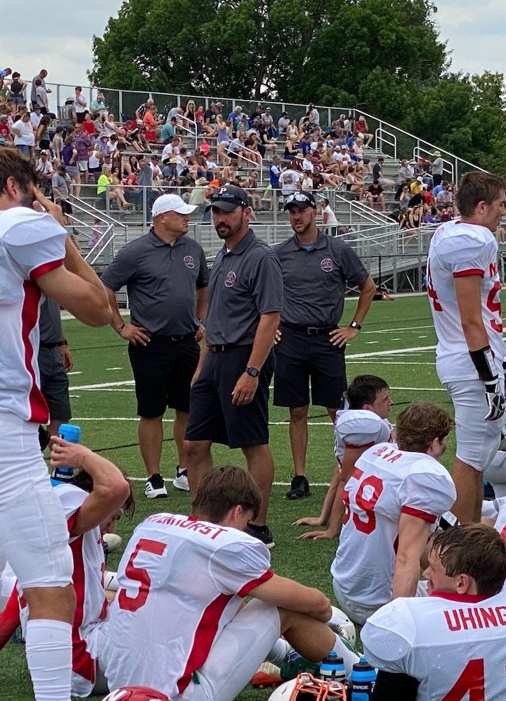 Coach Kyle Schmidt (center) and Jeremy Peter (at right).
