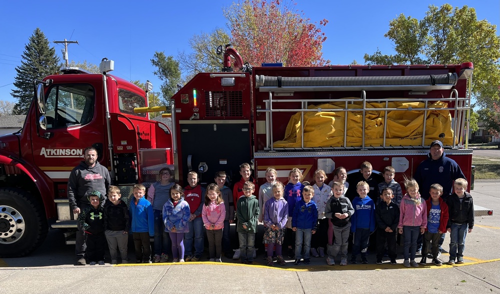 Pre-K, Kindergarten, and Second Grade students pictured with one of Atkinson Fire and Rescue’s fire trucks