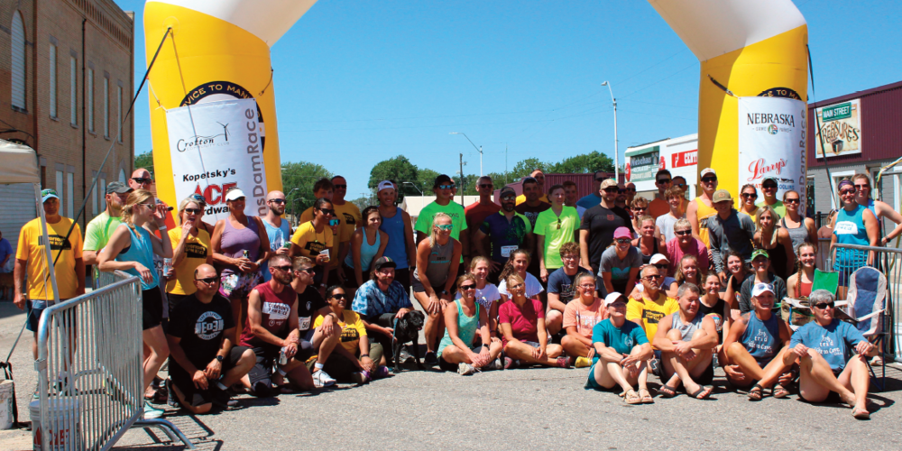 Dam Racers from near and far gathered for a picture at the end of the 2022 Crofton Dam Race in downtown Crofton this past Saturday.