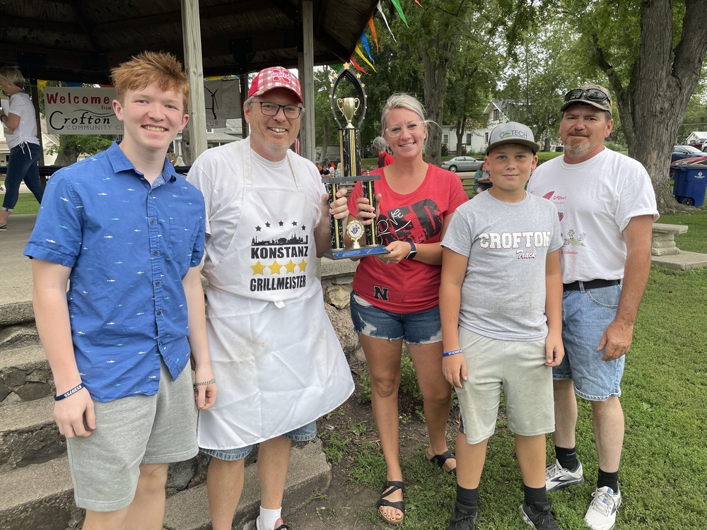Saint Rose Knights of Columbus Grillfest winner with grilled peaches and ice cream. Duane Schieffer and family (l to r): Jack, Duane, Angela Kolterman the “CCC Trophy Queen”, Layne and Brad.
