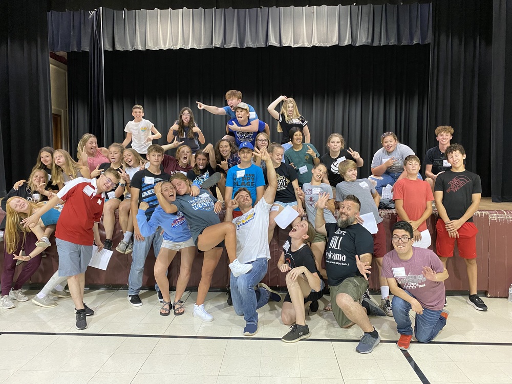 Front right (black shirt) - guest presenter T. Adam Goos of Wakefield’s Little Red Hen Theatre “strikes a pose” with the Crofton One-Act troupe