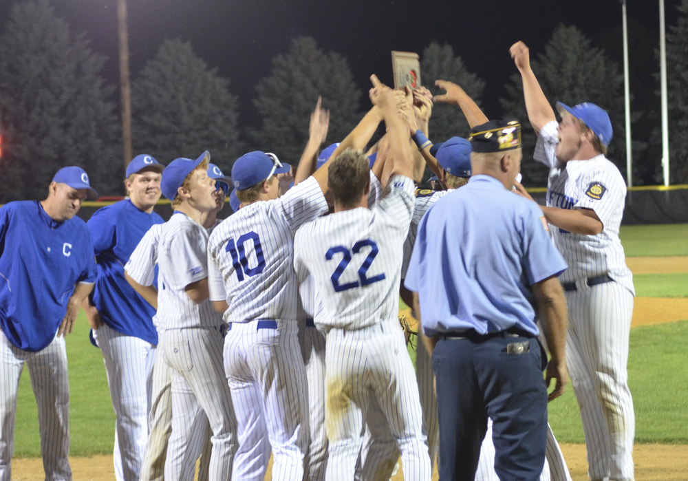 Crofton Legion Juniors celebrate and hoist their Area tournament plaque after receiving the championship award from American Legion Post 128 commander, Shane Wieseler following a dramatic 8-7 victory over top seeded Hartington.