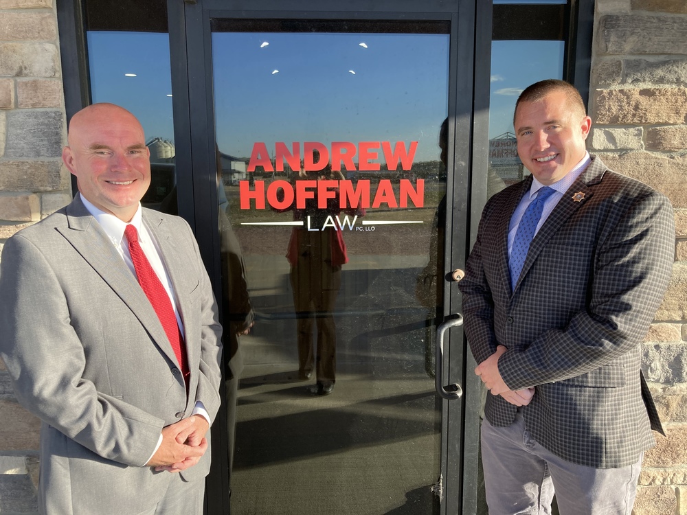 Andrew Hoffman and Brent Kelly in front of the Andrew Hoffman Law office in Atkinson. Courtesy Photo