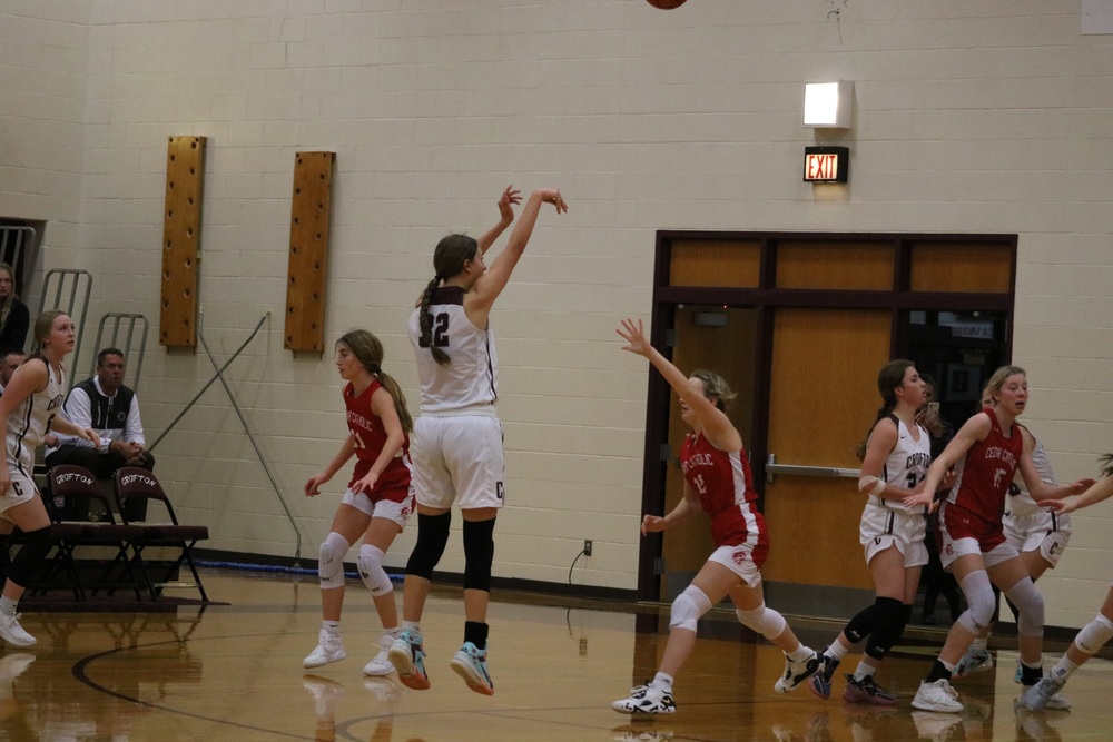 Caitlin Guenther shoots a three.
