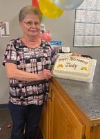 Cash honored on her retirement from bank