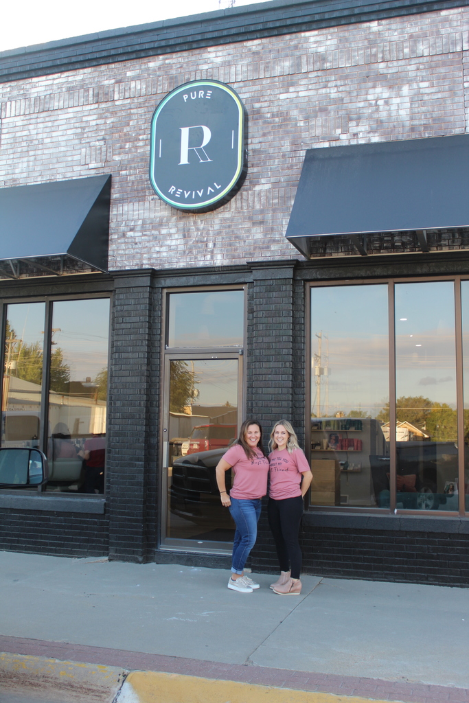 Pure Revival storefront and owners