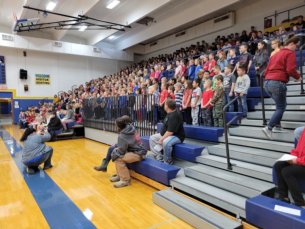 West Holt third and fourth graders seated on the left sang “Thank a Vet” and the kindergarten through second grade students on the right sang “In Service of Our Country” at the Veterans Day Program.