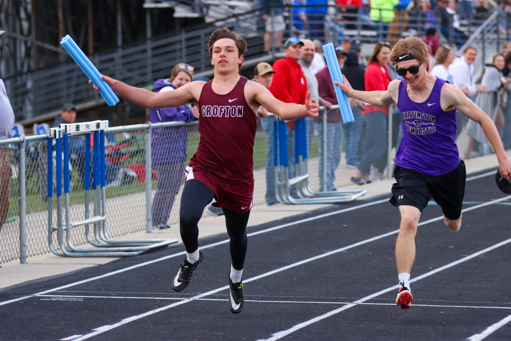 Will Steffen crosses the finish line during the Field Event 4x100 Relay in Pierce.