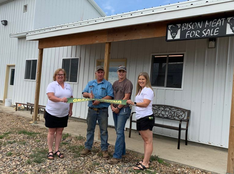 Ribbon cutting held for butcher shop...