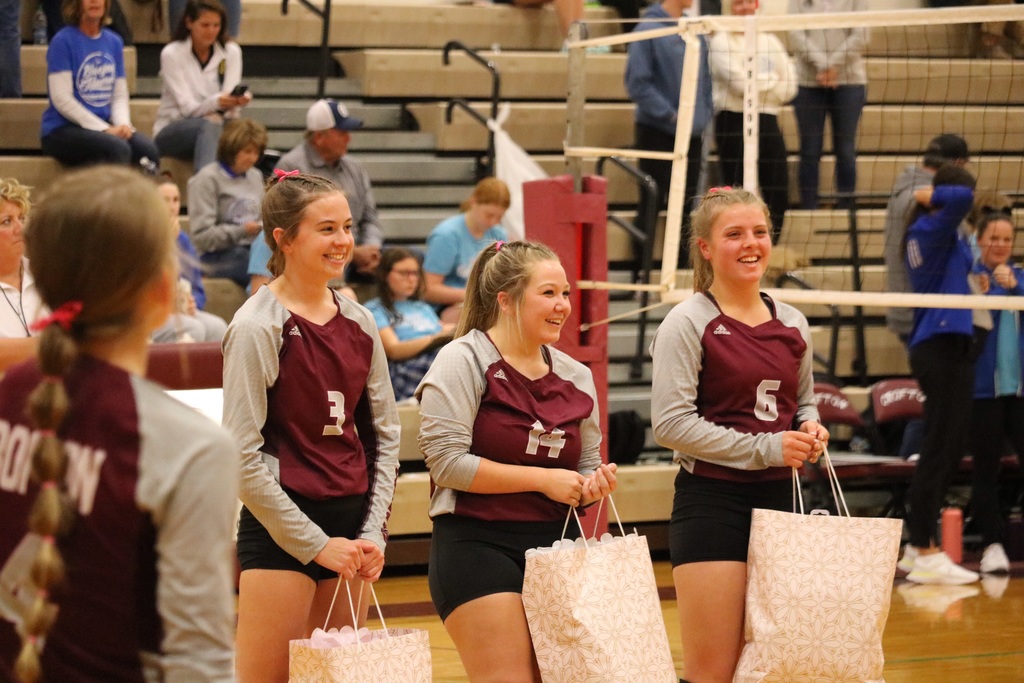 Seniors Rebecca Leader, Kayden Acuff, and Megan Tramp holding their gifts awarded to them.