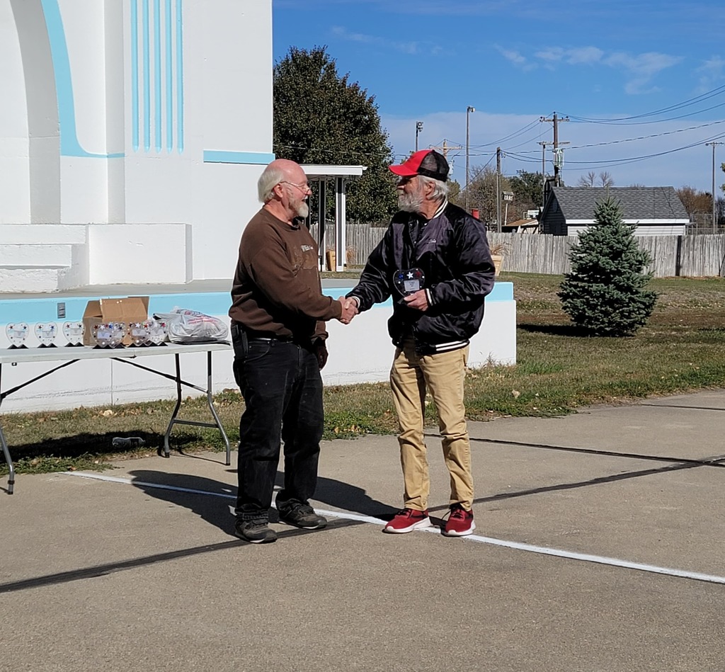 Dale Ristow is presented with the Farmers Market Hero Award