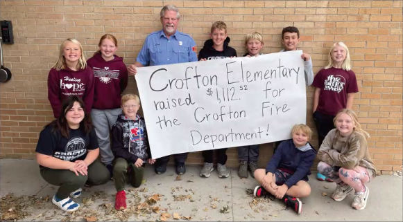 The Crofton Elementary Student Council and Dave Hansen. Student Council members helped guide the week-long event with  encouraging posters and announcements for the students to help raise money for the CVFD.