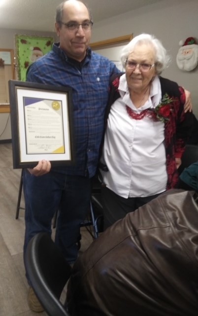 Mayor Bob Evans (pictured with Enid) read the proclamation declaring, Tuesday, December 27, 2022 “Enid Kollars Day.”
