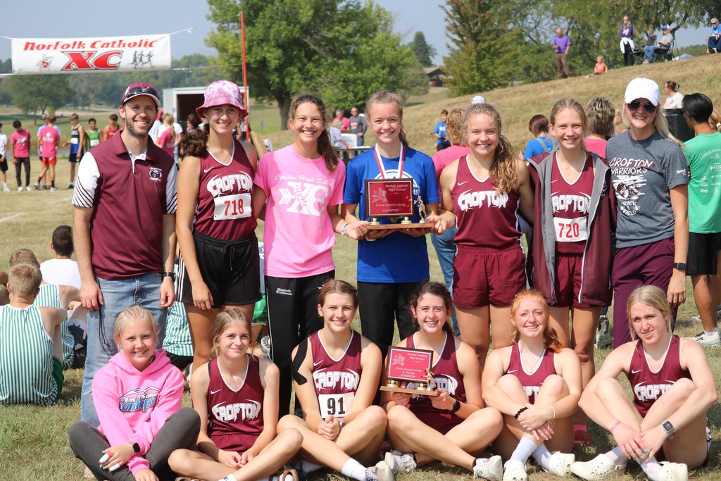 Crofton Girls Cross Countr y team with first place trophy. Top row L to R, Coach Mickey Doerr, Emily Guenther, Elizabeth Wortmann, Jordyn Arens, Rylie Arens, Sophia Wortmann, and Coach Rachel Kaup. Bottom row Olivia Walter, Madelyn Buschkamp, Brooklyn Guenther, Jenna Jackson, Pamela Dennis, and Elizabeth DeRoos.